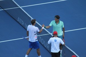 Pospisil and Roger Federer (photo: Brian Taylor)